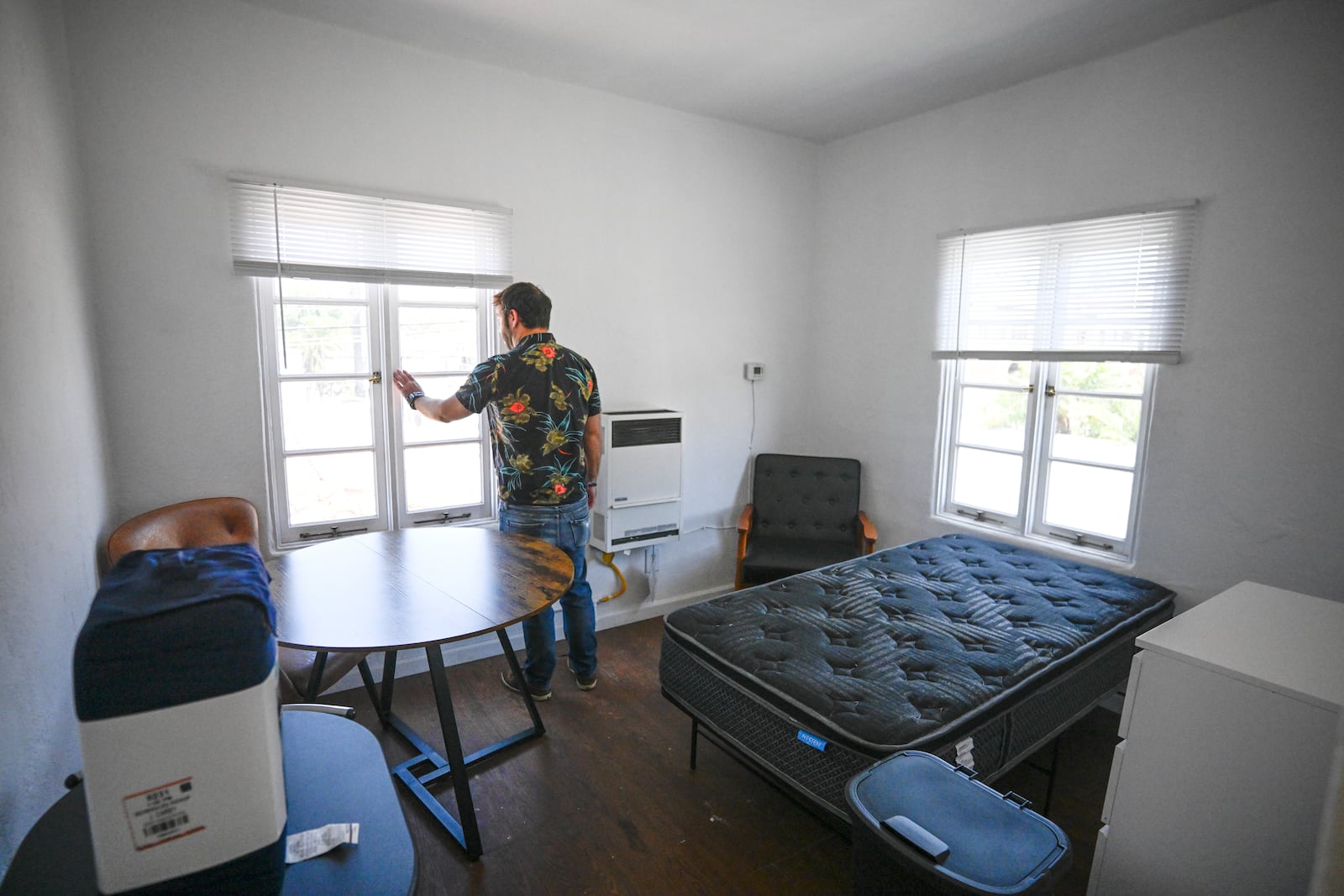 James Carey, housing director for the Friendship Shelter, gives a tour of the one of the apartments that the organization provides for homeless people, Monday, July 7, 2025, in San Clemente, Calif. (AP Photo/Denis Poroy)