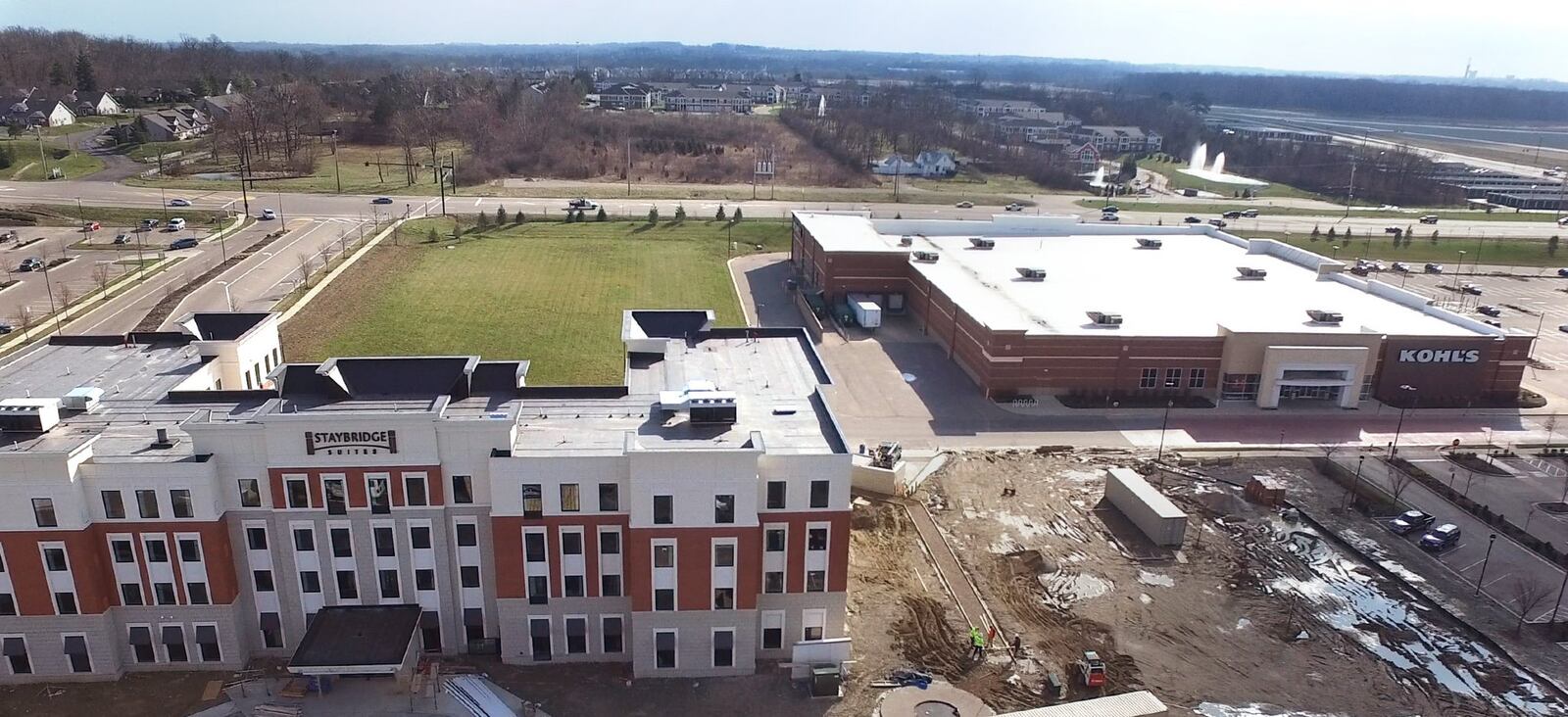 The entrance to Austin Landing from State Route 741 can be seen at the left of this photo behind the Staybridge Hotel. Further development is planned for the grass area beind the Hotel, next to Kohl’s. TY GREENLEES / STAFF