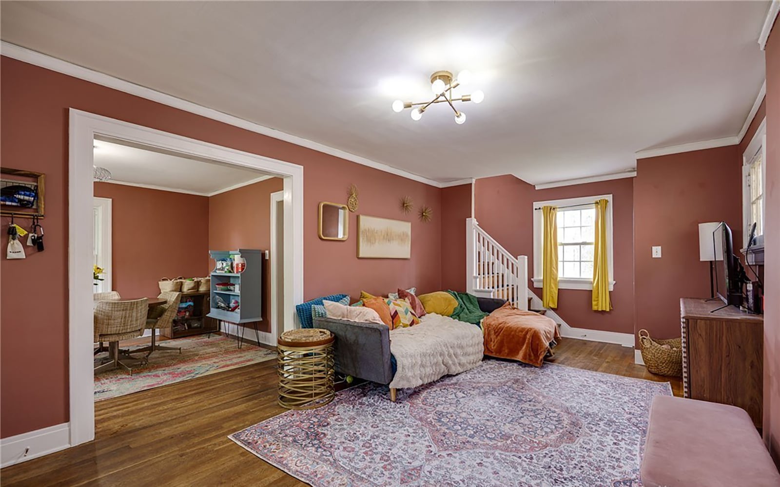 Refinished hardwood floors flow throughout the main level, including the living and dining rooms.