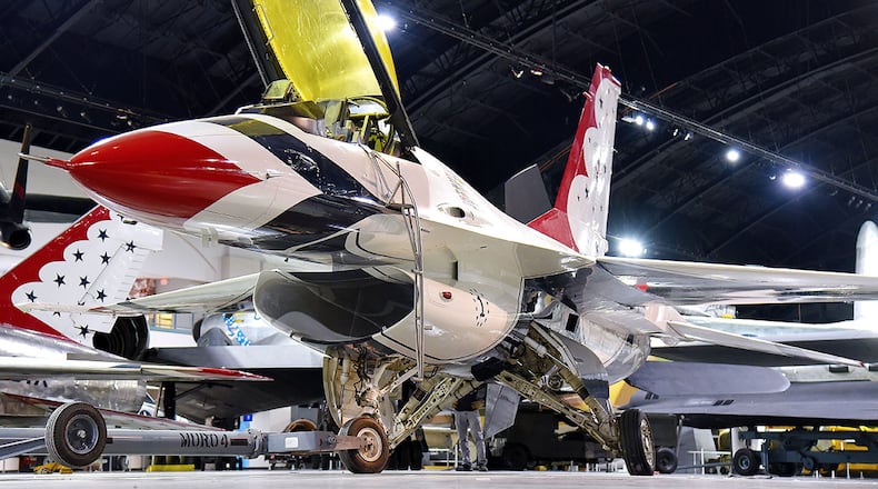 Museum restoration crews move the General Dynamics F-16A Fighting Falcon in the Cold War Gallery at the National Museum of the U.S. Air Force. The F-16 on display was one of the first F-16s to be received by the Thunderbirds in 1982 when they transitioned from T-38s to F-16s. U.S. AIR FORCE PHOTO/KEN LAROCK