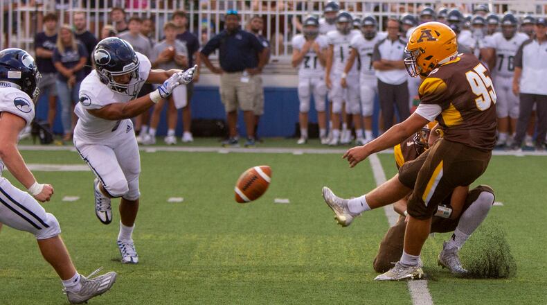 Fairmont's Kamron Payne blocks a field goal that led to a touchdown during Fairmont's 31-7 victory over Alter last year at Roush Stadium.
