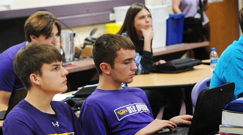 Students in a AP Computer Science class at Bellbrook High School. Back row left to right is Ben Hunt and Aidan Jones. Front row left to right is Matteo Krivitzky and Zach Shore. MARSHALL GORBY\STAFF