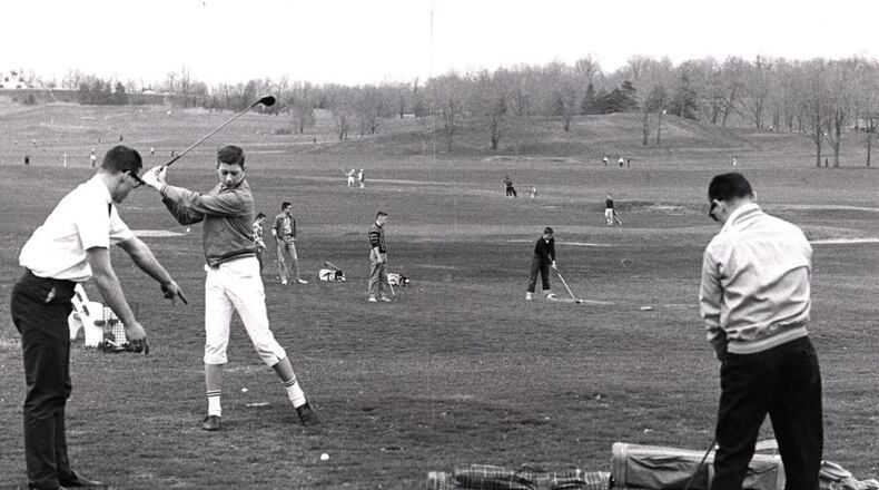 Beginning golfer Harry Saetteo of Kettering gets pointers from his older brother, Bud, at Community Golf Course in 1962. DAYTON DAILY NEWS ARCHIVE