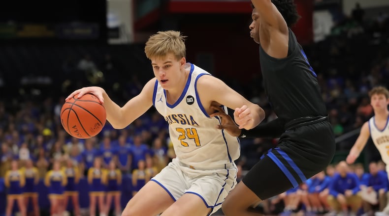 Russia High School's Braylon Cordonnier is guarded by Richmond Heights' Jeremy Wilson during a Division IV state semifinal game on Friday, March 17 at University of Dayton Arena. CONTRIBUTED PHOTO BY MICHAEL COOPER