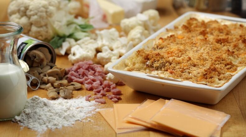 The cauliflower casserole, dubbed Company Casserole on the original recipe card from grandma, called for Old English cheese slices and canned mushrooms. (E. Jason Wambsgans/Chicago Tribune/TNS)