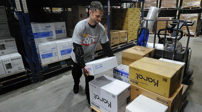 I Supply Company employee Joseph Wood loads a skid with supplies Thursday, Feb. 15, 2024. I Supply Company a regional provider of disposable packaging, janitorial/sanitation supplies, and customized foodservice distribution is marking its 80th year in operation. MARSHALL GORBY\STAFF