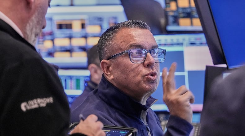 Trader Robert FInnerty Jr. works on the floor of the New York Stock Exchange, Thursday, Feb. 5, 2026. (AP Photo/Richard Drew)