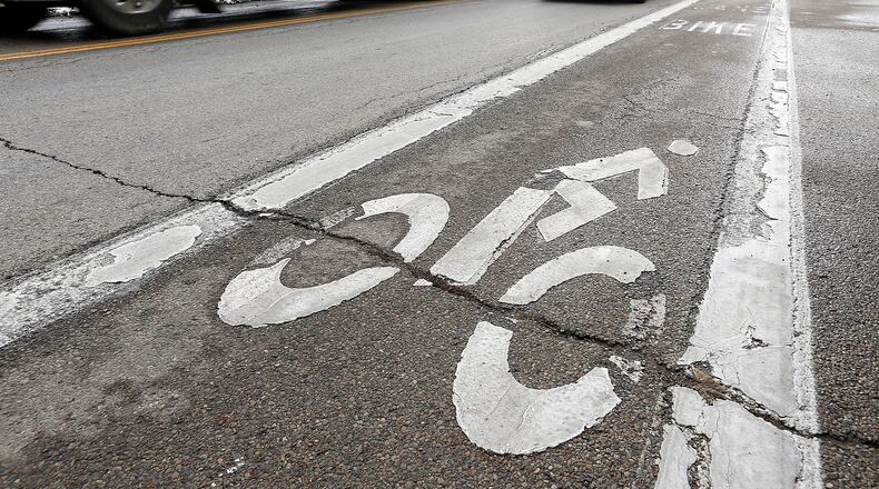 Plans to make biking safer in Yellow Springs may include dedicating a portion of roadways to bicyclists, similar to this bike lane in Springfield. Bill Lackey/Staff