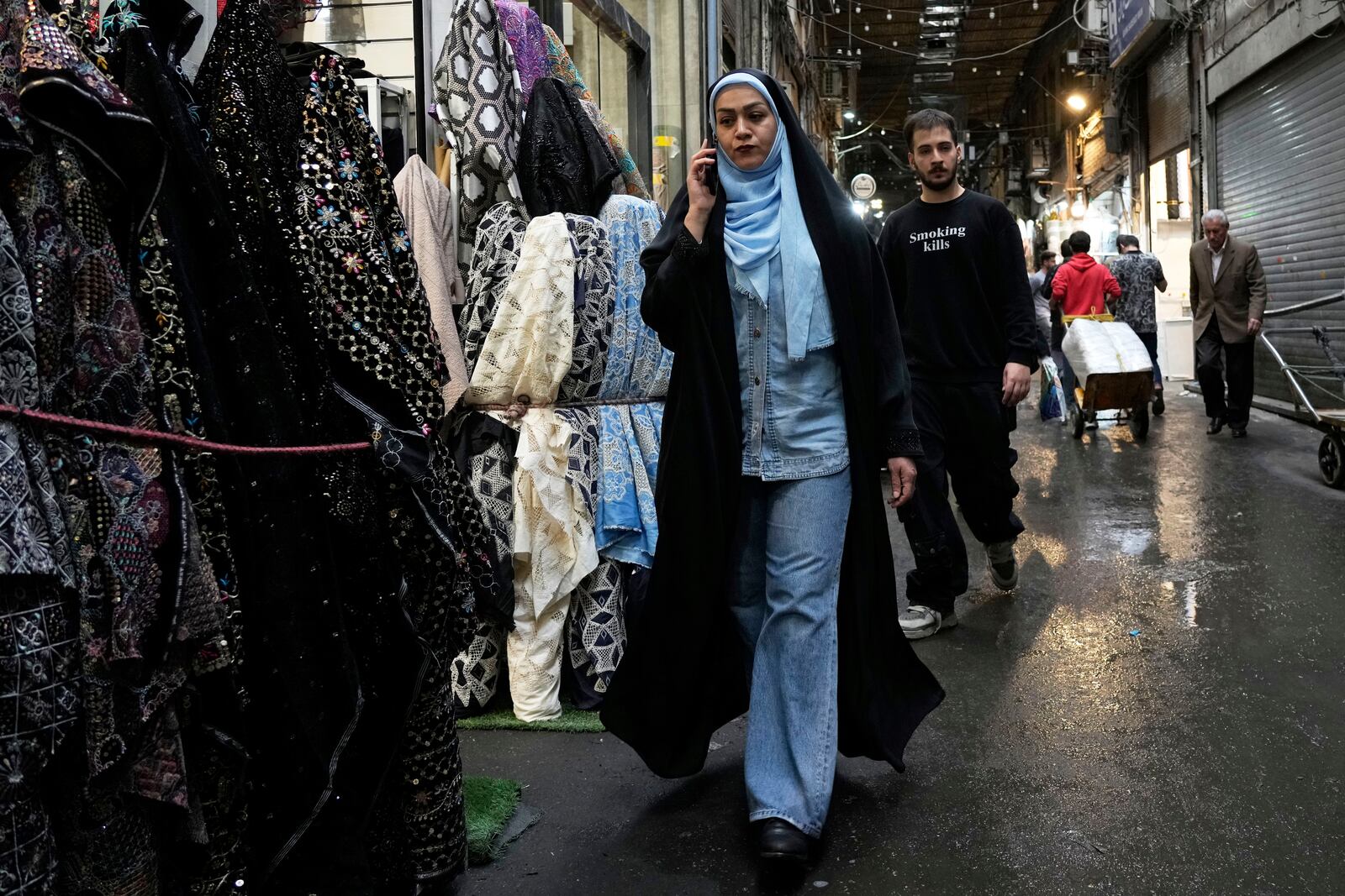 People walk through the old grand bazaar of Tehran, Iran, Saturday, April 5, 2025. (AP Photo/Vahid Salemi)