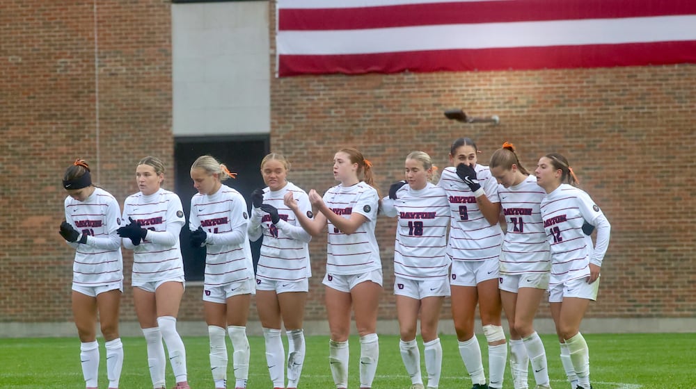 Dayton players watch the penalty kick shootout against Rhode Island in the Atlantic 10 Conference tournament championship game on Sunday, Nov. 9, 2025, at Baujan Field. David Jablonski/Staff
