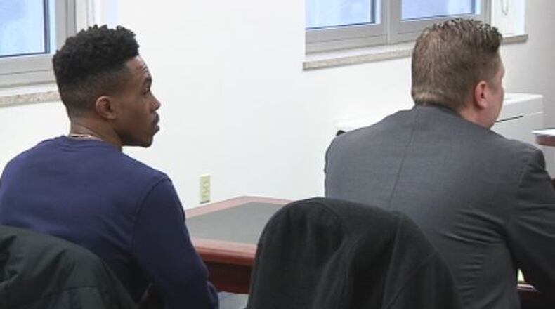 Ryon Lucas, 21, appears with his attorney in Champaign County Common Pleas Court on Thursday morning. Lucas is charged with aggravated robbery in connection with an incident at Urbana University on Nov. 6 that sent the campus into lockdown. JENNA LAWSON/STAFF.