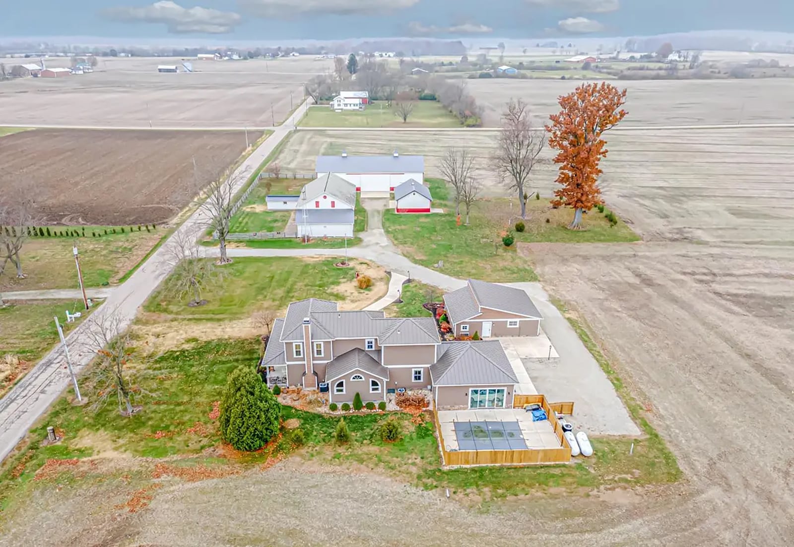 The home has three barns, an attached and detached garage and an inground saltwater plunge pool with wood privacy fence surrounding it. CONTRIBUTED