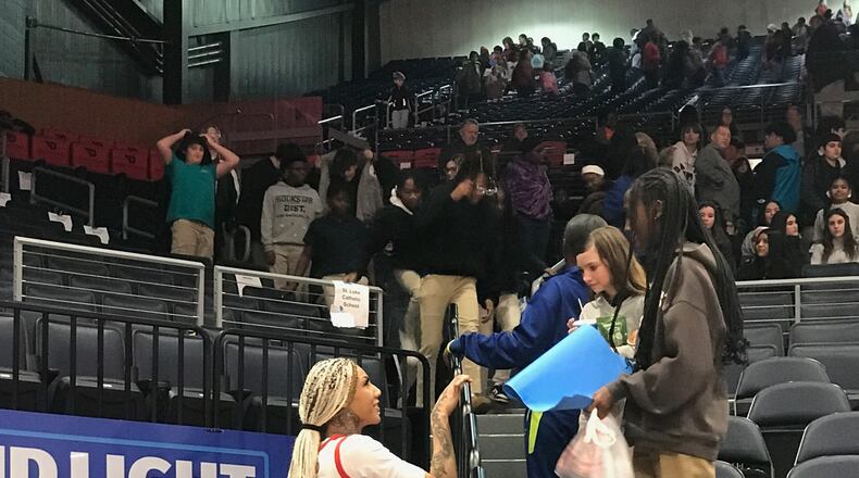 Eve Fiala was one of the most popular Flyers players Wednesday at the annual School Day game that this year set the all-time UD Arena attendance record for a Dayton women’s game with a crowd of 12,129, most of which were young students from 62 area schools. UD lost to Davidson 61-51 but afterward the 6-foot-5 Fiala stayed to sign autographs and engage with the crowd. Tom Archdeacon/CONTRIBUTED