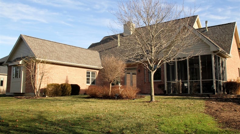 A screen-enclosed porch is accessible from a room, which allows for a variety of uses, including a possible second main bedroom, a family room or an office. The room has a closet and private access to a full bathroom.