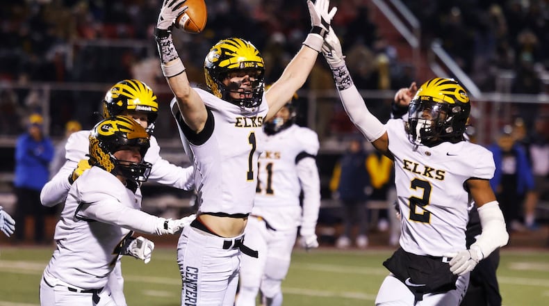 Centerville's Jacob Taylor celebrates and interception during their Division I state semifinal football game against Moeller Friday, Nov. 29, 2024 at Princeton High School in Sharonville. NICK GRAHAM/STAFF