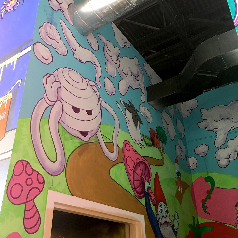 PHOTOS: Wild and wacky murals take over new restaurant at The Greene