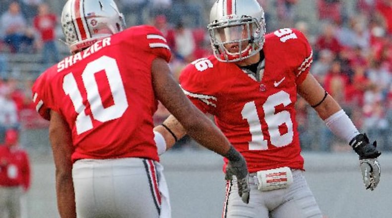 Ohio State Buckeyes defensive back Zach Domicone (16) congratulates Ohio State Buckeyes linebacker Ryan Shazier (10) on a tackle in the fourth quarter of the game between Colorado and Ohio State at Ohio Stadium, Columbus, Ohio. Ohio State defeated Colorado 37-17. SCOTT STUART / DAYTON DAILY NEWS