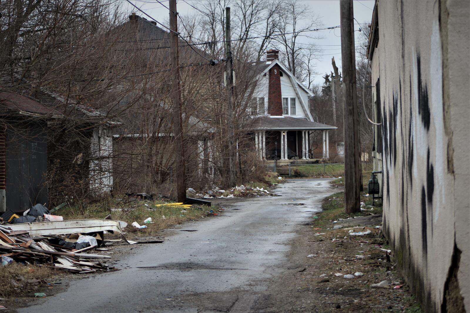 Damian Chancellor, 23, was fatally shot in this alley behind the 2100 block of North Main Street in Dayton on Feb. 5, 2019. CORNELIUS FROLIK / STAFF