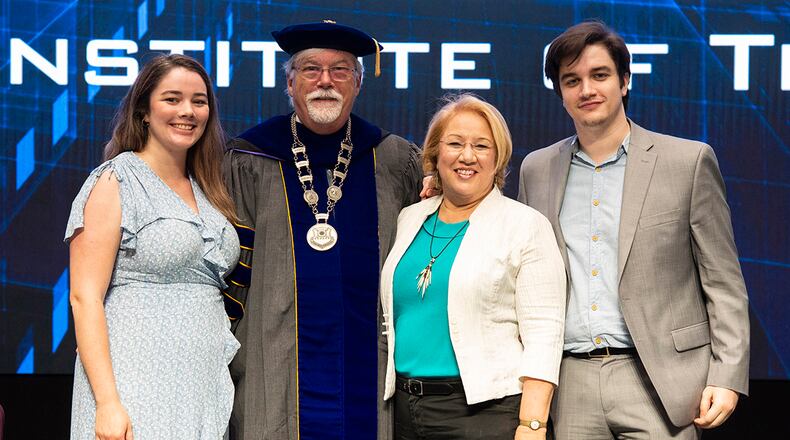 Dr. Walter Jones, new Air Force Institute of Technology director and chancellor, poses for a photo with his family during an acceptance-of-leadership ceremony July 27 at Wright-Patterson Air Force Base. U.S. AIR FORCE PHOTO/WESLEY FARNSWORTH