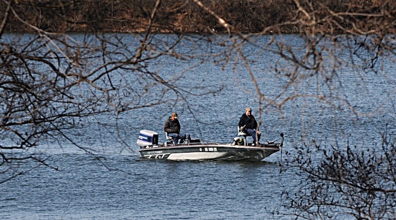 FILE PHOTO: Fisherman take advantage of sunny skies and warm weather on Eastwood Lake in February. MARSHALL GORBY / STAFF