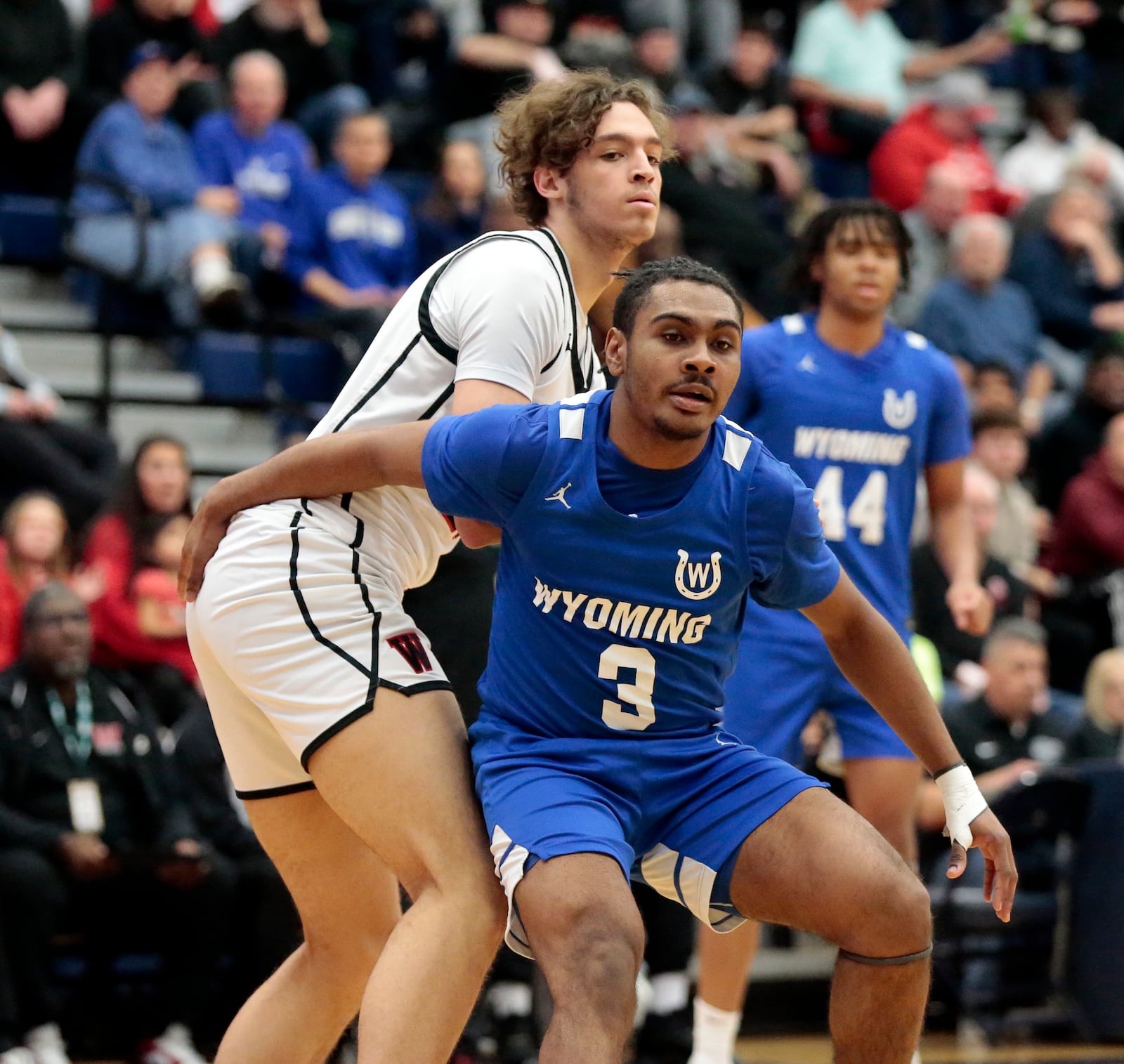 Wyoming's Darren Gray guards Wayne senior Alphonso Ward. Wyoming defeated Wayne 60-49 at the 2026 The Beacon Orthopaedics Flyin' to the Hoop showcase at Trent Arena in Kettering. STEVEN WRIGHT / STAFF