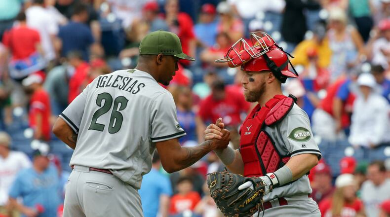 PHILADELPHIA, PA - MAY 28: Closer Raisel Iglesias #26 of the Cincinnati Reds is congratulated by Tucker Barnhart #16 after the final out of a game against the Philadelphia Phillies at Citizens Bank Park on May 28, 2017 in Philadelphia, Pennsylvania. The Reds won 8-4. (Photo by Hunter Martin/Getty Images)