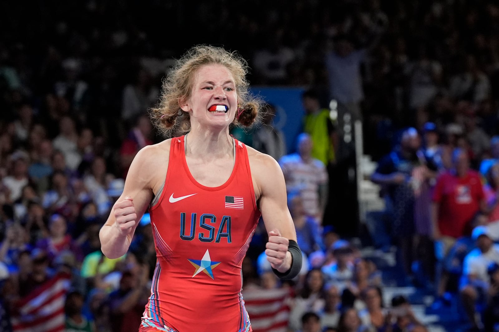 FILE - United State's Sarah Hildebrandt celebrates after defeating Mongolia's Otgonjargal Dolgorjav during their women's freestyle 50kg wrestling semifinal match, Aug. 6, 2024 at Champ-de-Mars Arena during the 2024 Summer Olympics in Paris, France. (AP Photo/Eugene Hoshiko, File)