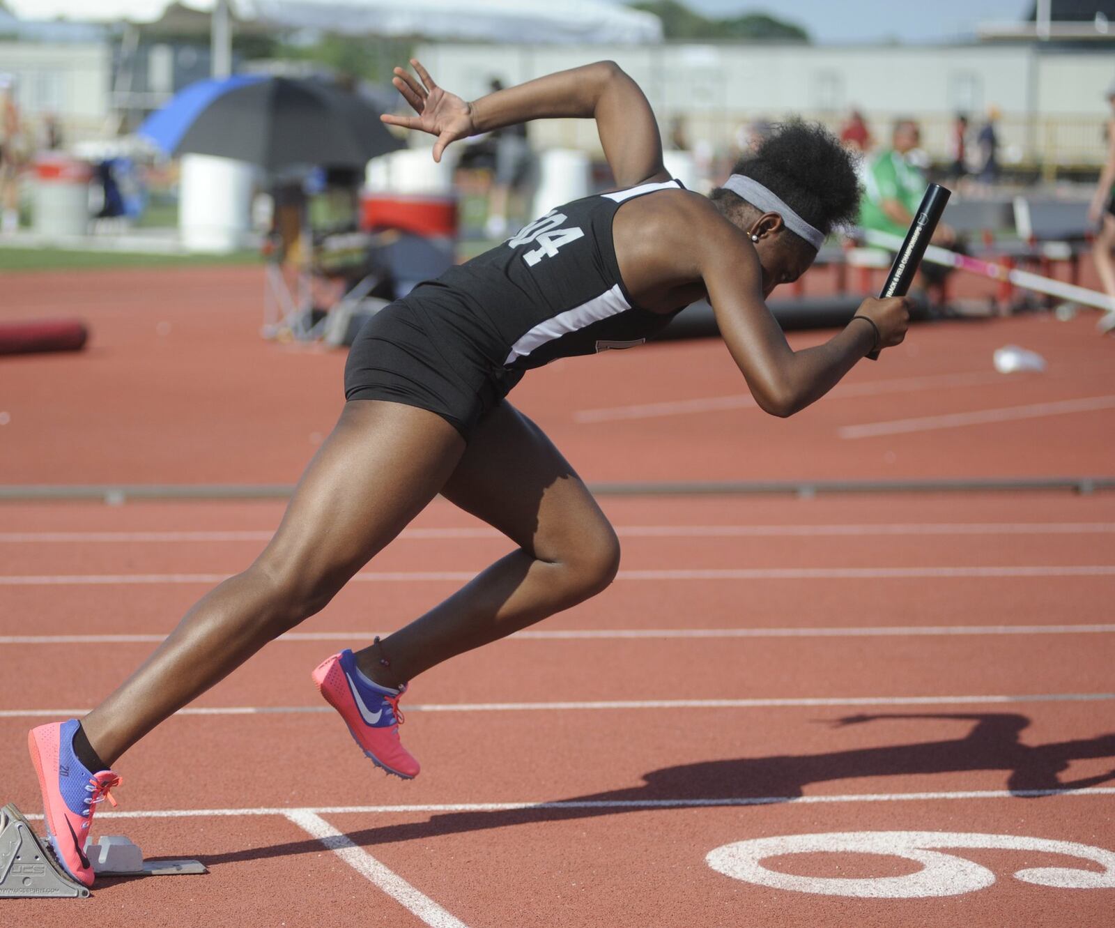 Lakota East’s Serena Clark blasts out of the 400 relay start during the Division I state track and field meet at Ohio State University’s Jesse Owens Memorial Stadium in Columbus on Saturday. MARC PENDLETON/STAFF