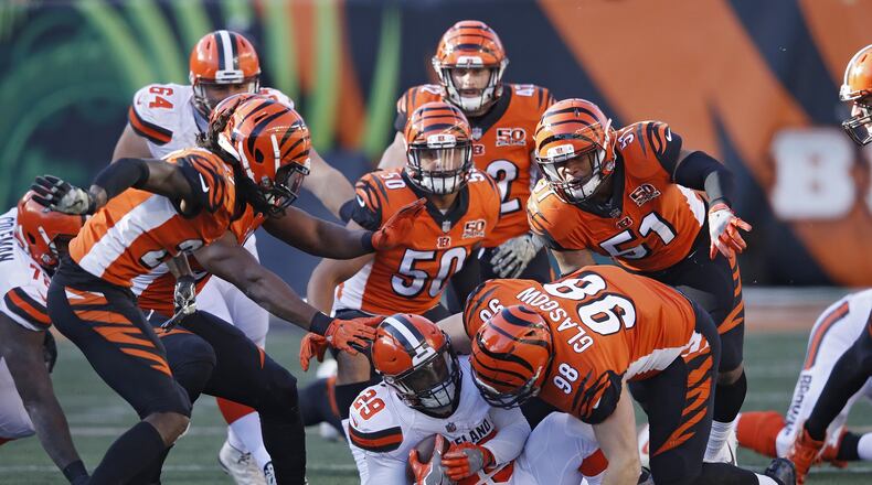 CINCINNATI, OH - NOVEMBER 26: Cincinnati Bengals defenders combine to tackle Duke Johnson Jr. #29 of the Cleveland Browns in the second half of a game at Paul Brown Stadium on November 26, 2017 in Cincinnati, Ohio. The Bengals won 30-16. (Photo by Joe Robbins/Getty Images)