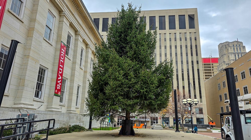 The 2025 Dayton Holiday Tree arrives at Courthouse Square on Nov. 13, 2025. BRYANT BILLING/STAFF