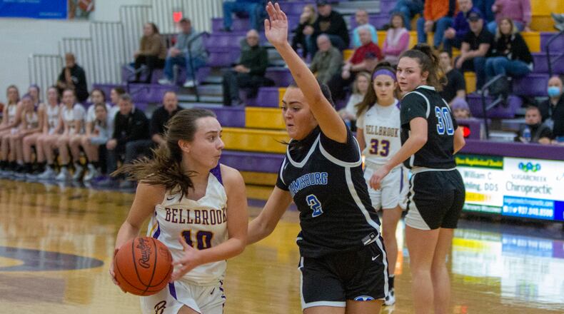 Bellbrook's Kelley Griffin looks for an open teammate against Miamisburg's Anna Long during Wednesday night's game at Bellbrook. Griffin scored 15 points and had nine assists in a 64-40 victory. Jeff Gilbert/CONTRIBUTED