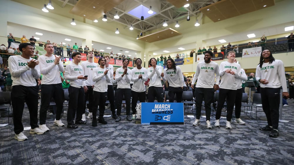 Wright State players react after the team's tournament seed and opponent was announced during an NCAA tournament selection watch party the athletic department held at the university's Student Union on Sunday, March 15 in Fairborn. BRYANT BILLING / STAFF