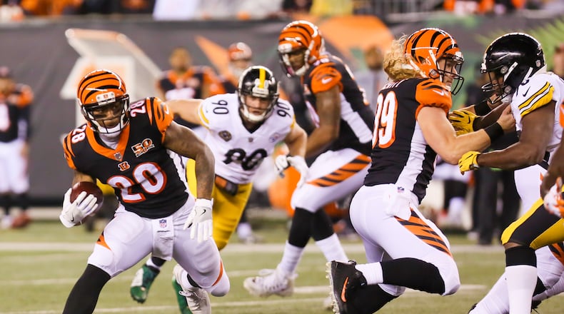 Bengals running back Joe Mixon (28) looks for yards during the first quarter of their game against the Steelers, at Paul Brown Stadium, Monday, Dec. 4, 2017. GREG LYNCH / STAFF