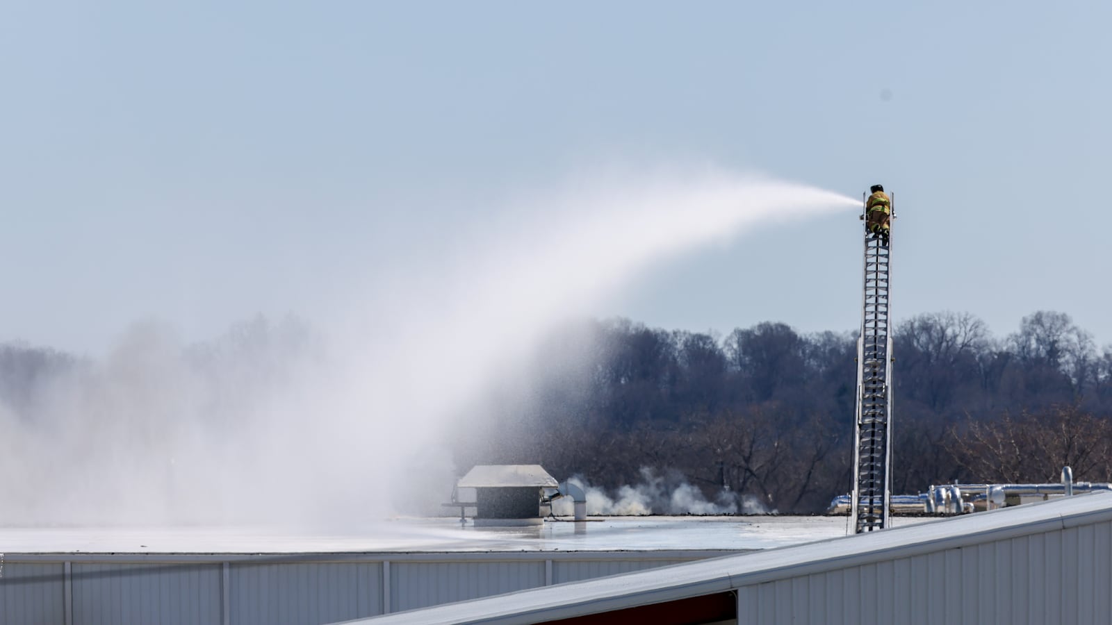 The fire at Fuyao Glass America rekindled shortly before noon on Tuesday, March 24. While firefighters have been working at the site since it first caught fire Sunday night, they had been focusing on hotspots before a large rekindling caused black smoke to rise that was visible for miles. The building that caught fire was Fuyao's coating facility, which was still in the finishing stages of construction. BRYANT BILLING / STAFF