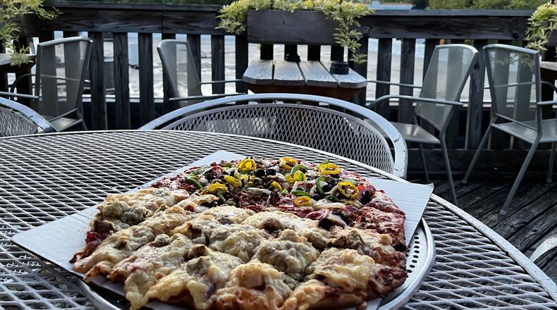 View from the patio at the Oregon Express with a Rueben pizza. PHOTO BY ALEXIS LARSEN
