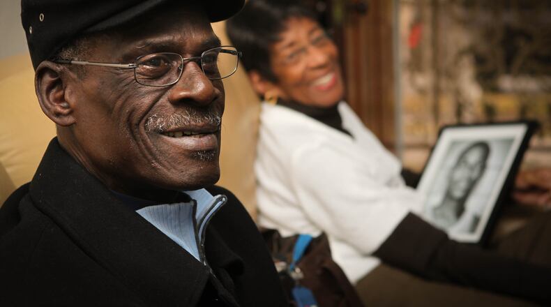 In the foreground is Ike Thornton, a teammate and friend of Roger Brown. In the background, Arlena Smith holds a portrait of Brown in his playing days in the 60's. She and her late husband Azariah were like parents, confidantes and best friends to Brown, the former University of Dayton basketball player and ABA legend , who is finally getting his due after an early-career witch hunt banned him from college and pro ball. Two weeks ago Brown was elected to the Naismith Basketball Hall of Fame. Thursday night he will be featured in a TV documentary -- “Undefeated: The Roger Brown Story. JIM WITMER / STAFF