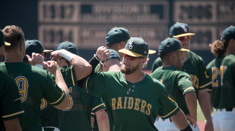 WSU junior and Northmont High School graduate Zach Weatherford celebrates with teammates after the Raiders beat UIC 10-1 in the Horizon League tournament at Nischwitz Stadium this past season. MATT HELTON / CONTRIBUTED