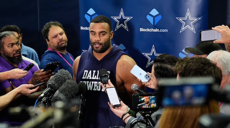 CORRECTS TO THURSDAY, NOV. 13 NOT FRIDAY, NOV. 14 - Dallas Cowboys' Solomon Thomas, center, responds to a question during a news conference after an NFL football practice at the team's headquarters Thursday, Nov. 13, 2025, in Frisco, Texas. (AP Photo/Tony Gutierrez)