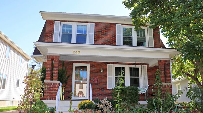 Located within the tree-lined neighborhood of Oakwood, this brick two-story at 246 Wiltshire Blvd. has about 2,462 square feet of living space, plus a finished basement. The home is listed for $449,900 by RE/MAX Victory and Associates. CONTRIBUTED