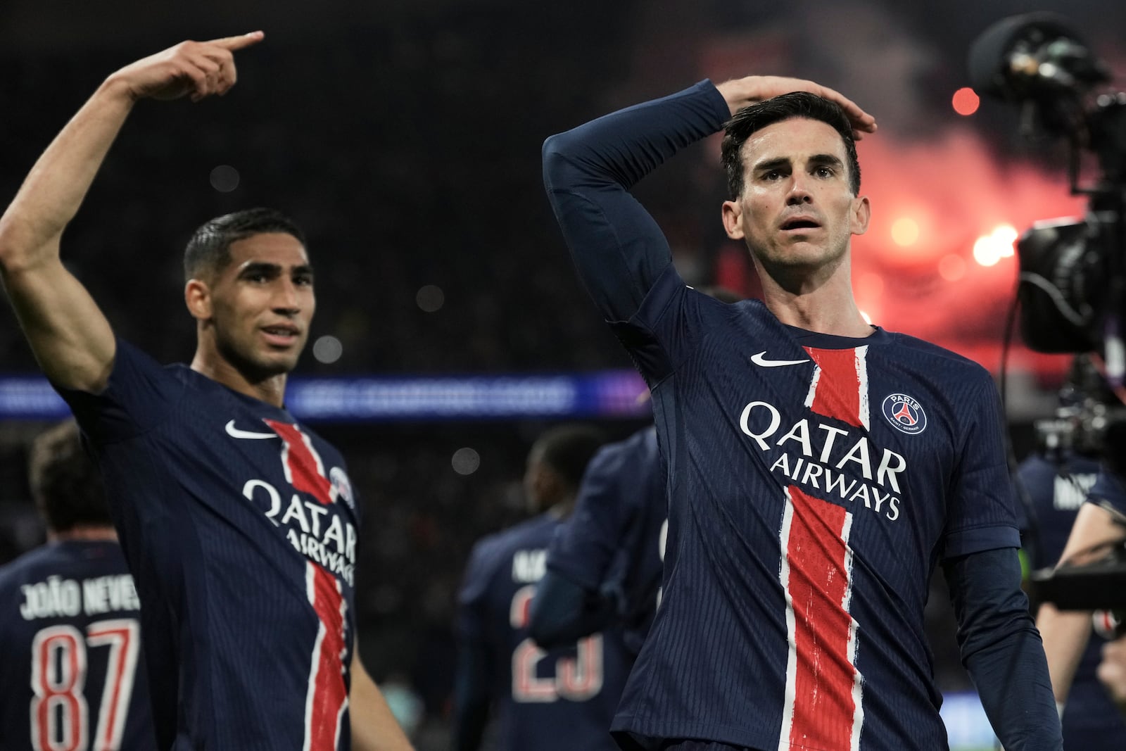 PSG's Fabian Ruiz, right, celebrates with team mate Achraf Hakimi after scoring his side's opening goal the Champions League semifinal, second leg soccer match between Paris Saint-Germain and Arsenal at the Parc des Princes in Paris, Wednesday, May 7, 2025. (AP Photo/Aurelien Morissard)
