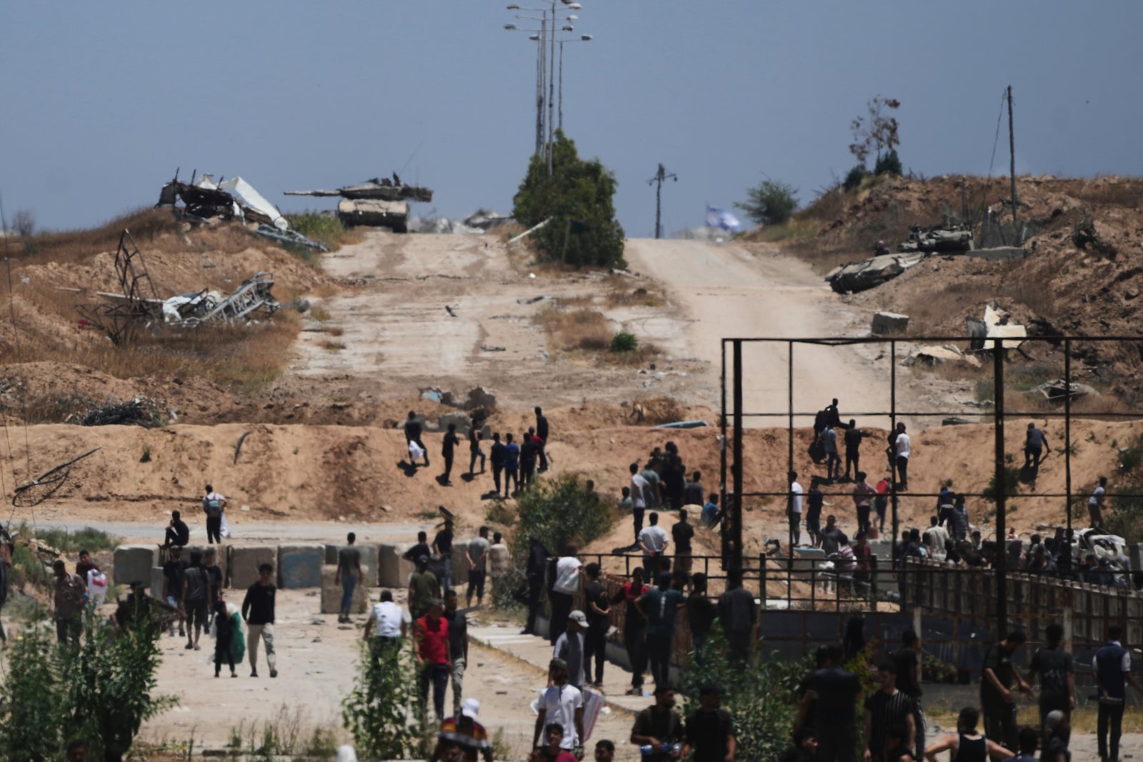 Israeli tanks taking position next to an humanitarian aid packages distribution center delivered by the Gaza Humanitarian Foundation, a U.S.-backed organization approved by Israel, in Khan Younis, southern Gaza Strip, on Thursday, May 29, 2025. (AP Photo/Abdel Kareem Hana)