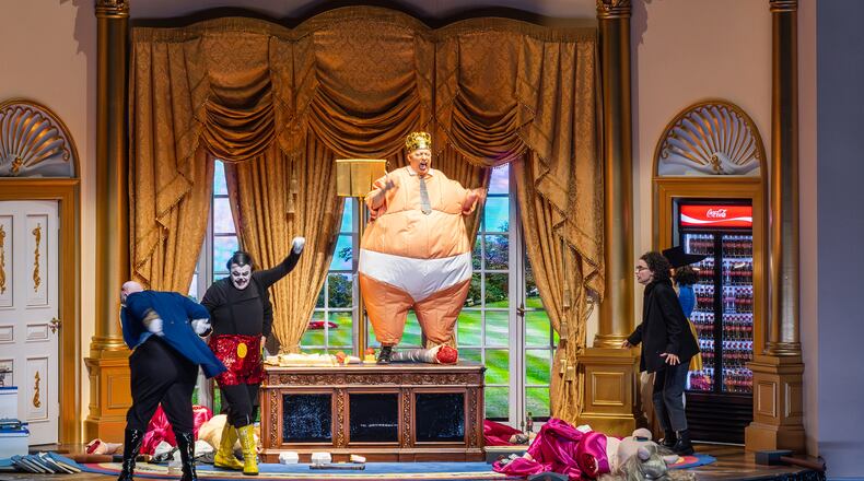 This image released by the Hamburg State Opera shows, from left, Eric Jurenas as Tuckey, Andrew Watts as Mickey, Georg Nigl as The King-President and Kristina Stanek as Bampi during a rehearsal of Olga Neuwirth’s “Monster’s Paradise” at the Hamburg State Opera on Jan. 28, 2026. (Tanja Dorendorf/Hamburg State Opera via AP)