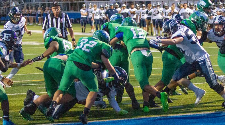 Chaminade Julienne quarterback Jonathan Peltier follows his blockers on his way to a 99-yard touchdown run in the final minute of the first half Friday night against Edgewood. CONTRIBUTED/Jeff Gilbert