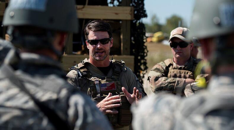 A trainer gives Airmen feedback on how they did in a training scenario during the Tech Warrior exercise at the National Center for Medical Readiness in Fairborn Sept. 26. The annual exercise gives scientists and technicians insight into conditions their technology may encounter out in the field as well as letting warriors give real-time feedback on how well a new technology performs. (U.S. Air Force photos/R.J. Oriez)