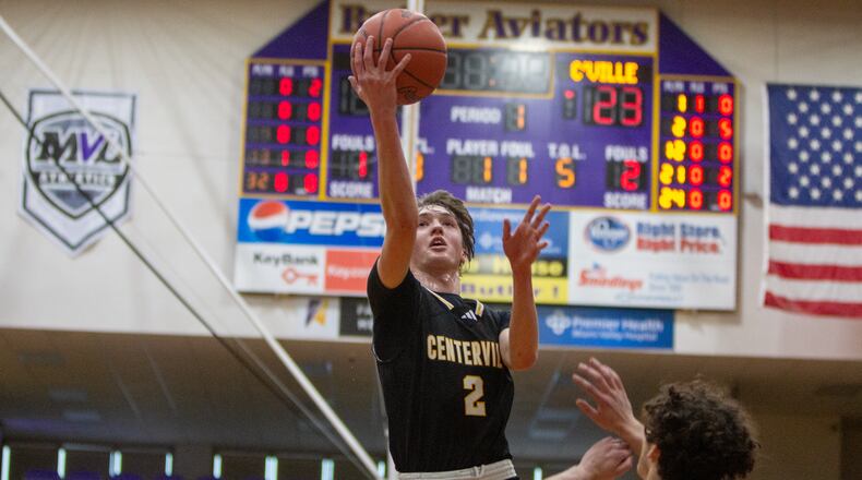 Centerville's Eli Greenberg scores during the first half of the Elks' Division I tournament victory over Xenia on Thursday at Butler High School. Jeff Gilbert/CONTRIBUTED