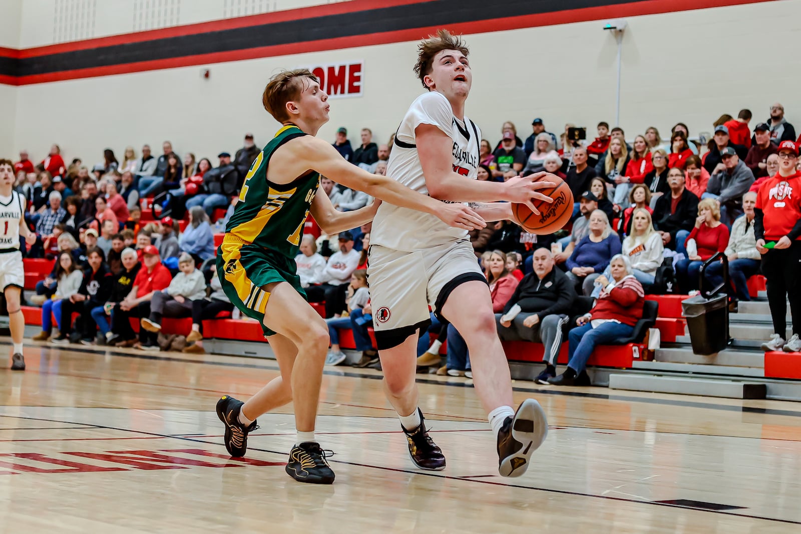 Cedarville High School sophomore Brayden Trimbach drives past a Madison Plains defender during their Ohio Heritage Conference South Division game on Friday, Jan. 30, 2026 in Cedarville. The Indians won 78-49. MICHAEL COOPER / STAFF