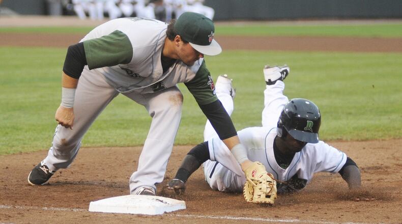 Fort Wayne first baseman Brad Zunica tags out Michael Beltre of the Dragons on a pickoff. The Fort Wayne TinCaps (Padres) visited the Dragons (Reds) in a Class A minor-league baseball at Dayton s Fifth Third Field on Monday, July 3, 2017. MARC PENDLETON / STAFF