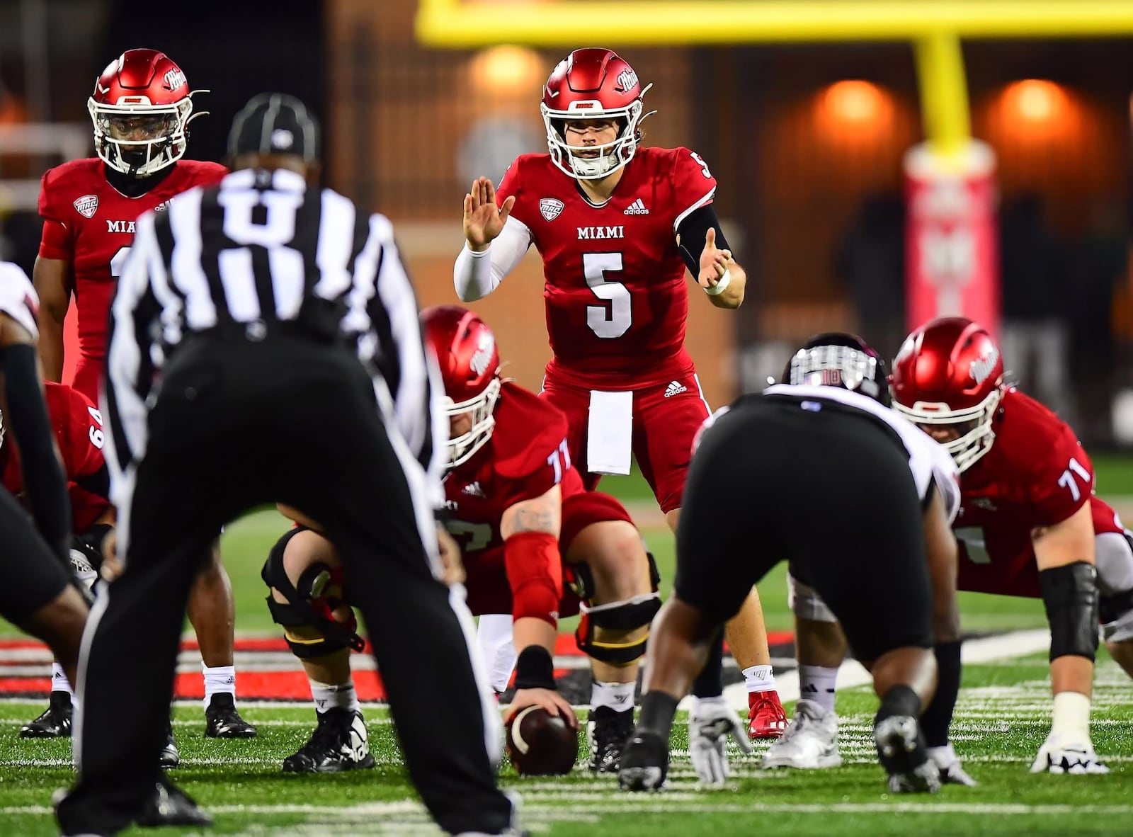 Brett Gabbert prepares to take a snap during Miami University's game against Northern Illinois last season at Yager Stadium. KYLE HENDRIX / CONTRIBUTED