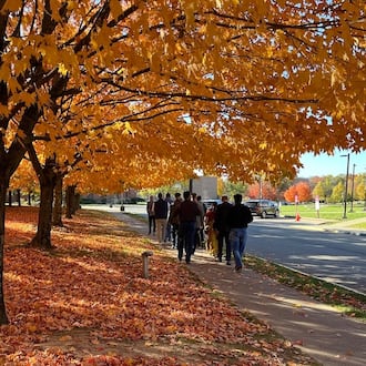 People walk along a sidewalk at Central State University campus on Oct. 24, 2024. The university recently reported it has about $26 million in unpaid tuition and fees that is more than a year past due. THOMAS GNAU/STAFF