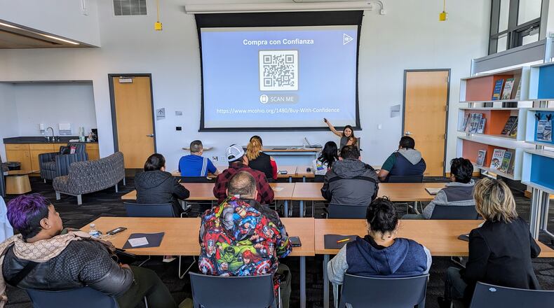 Montgomery County deputy auditor Stephanie Patino-Garfias speaks with property owners at a Spanish-language presentation on April 6 about steps they should take when pursuing home ownership.